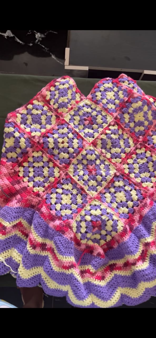 Granny-square crochet blanket in pastels